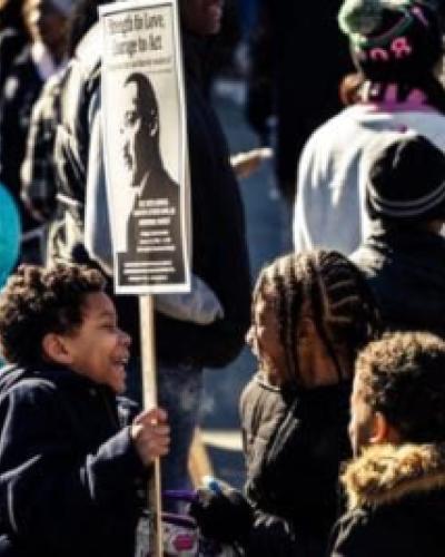 children with Martin Luther King Jr. sign