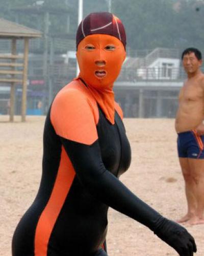 person with full face mask at beach